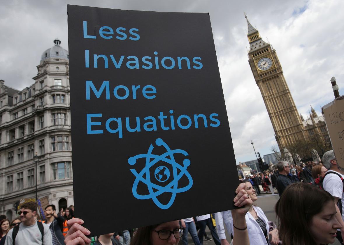 671470228-protestor-holds-a-placard-as-scientists-and-science_1.jpg.CROP.promo-xlarge2
