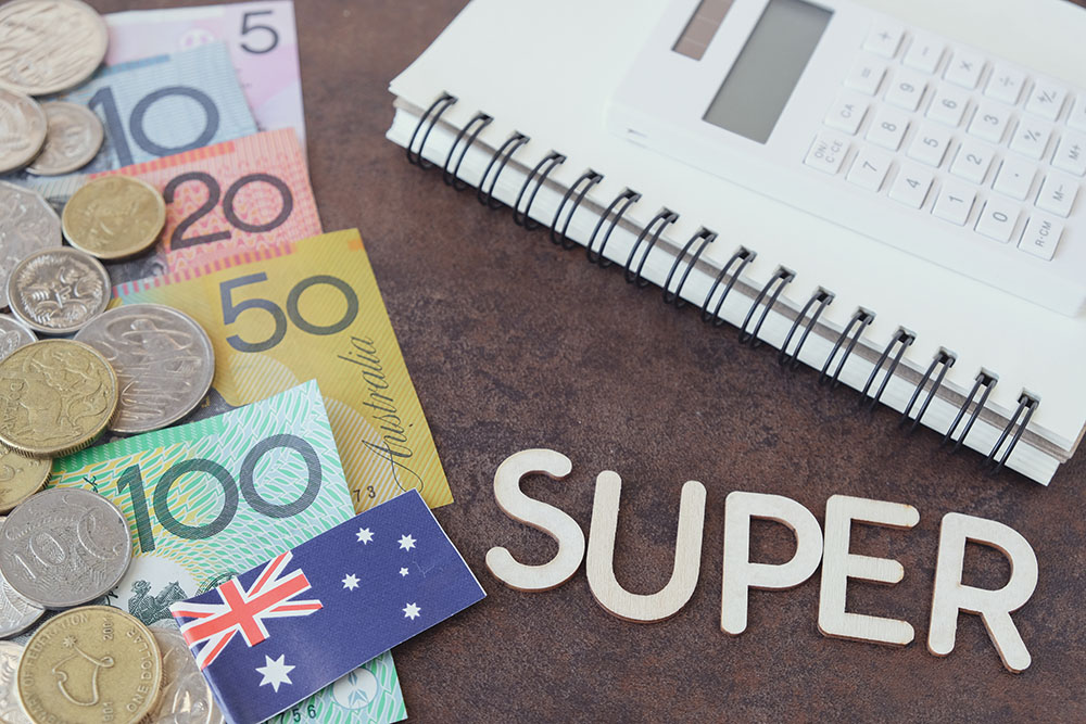 Australian money, AUD with SUPER word, calculator, and notebook