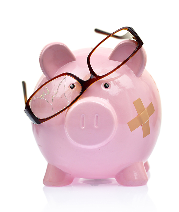 Piggy bank with broken eyeglasses and bandage